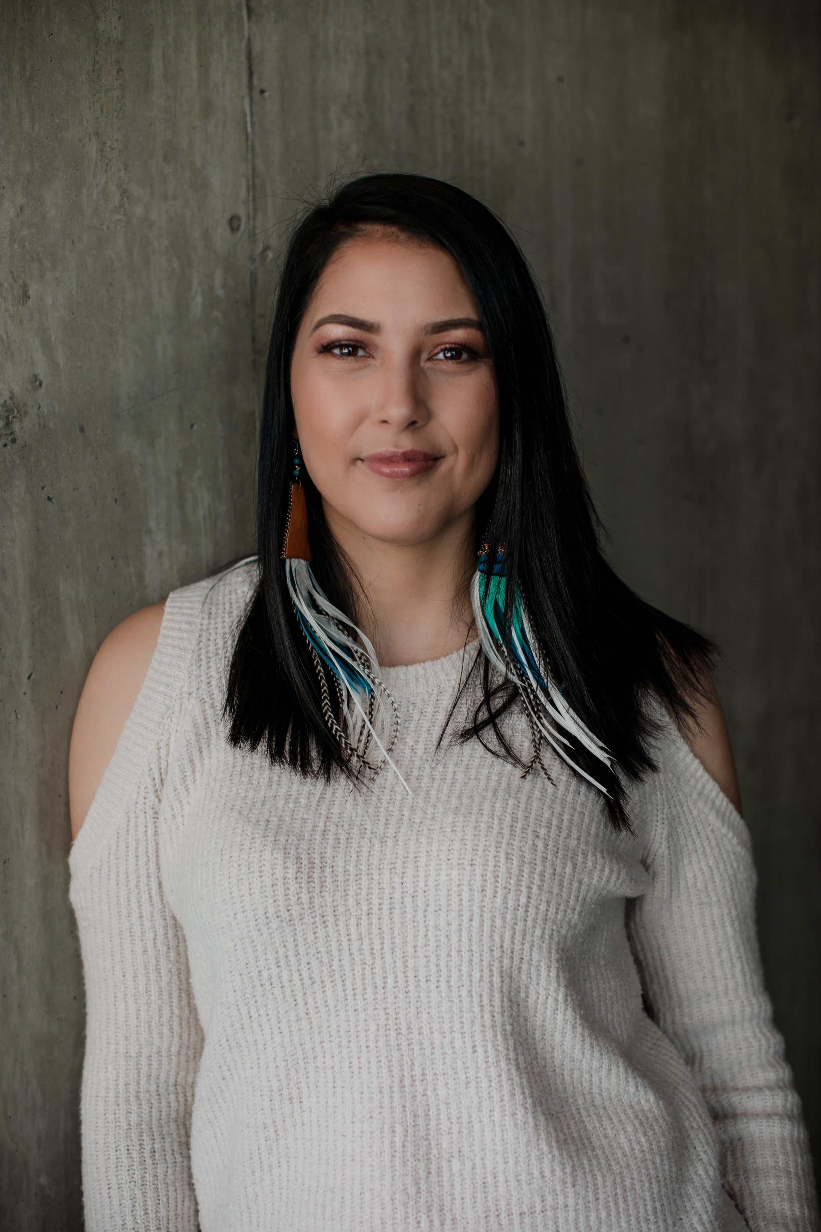 files/woman-in-white-sweater-looks-into-camera-lens.jpg